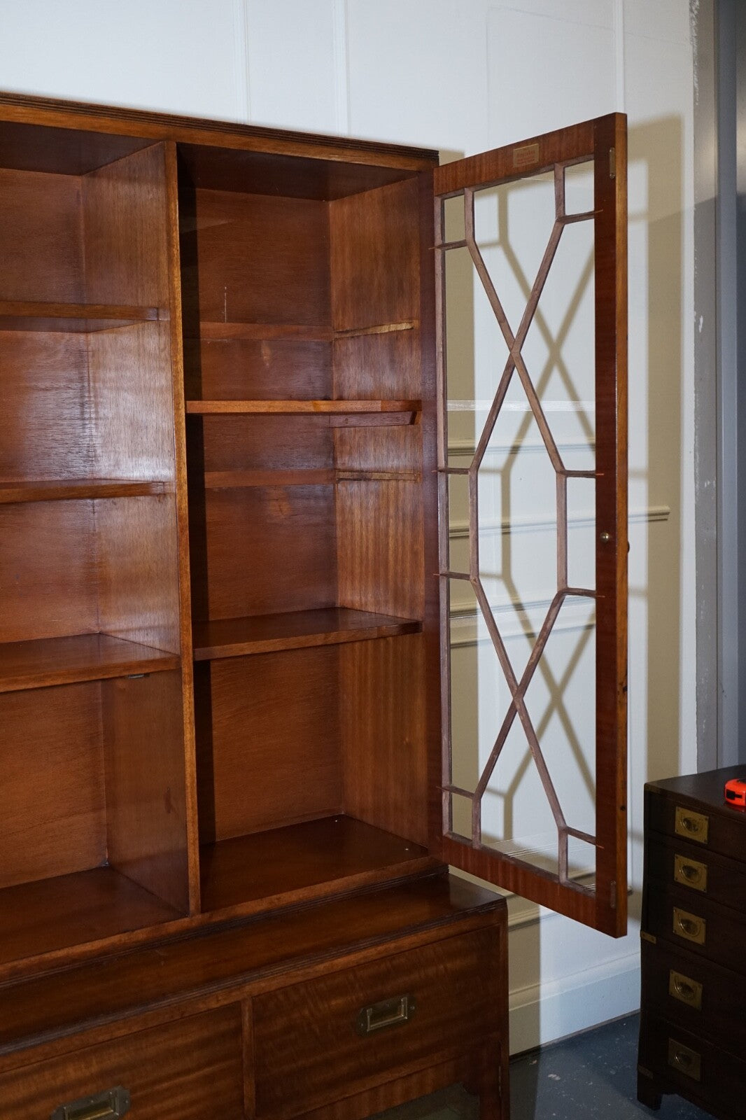 VINTAGE BEVAN FUNNELL MILITARY CAMPAIGN BOOKCASE WITH EMBOSSED LEATHER DOORS