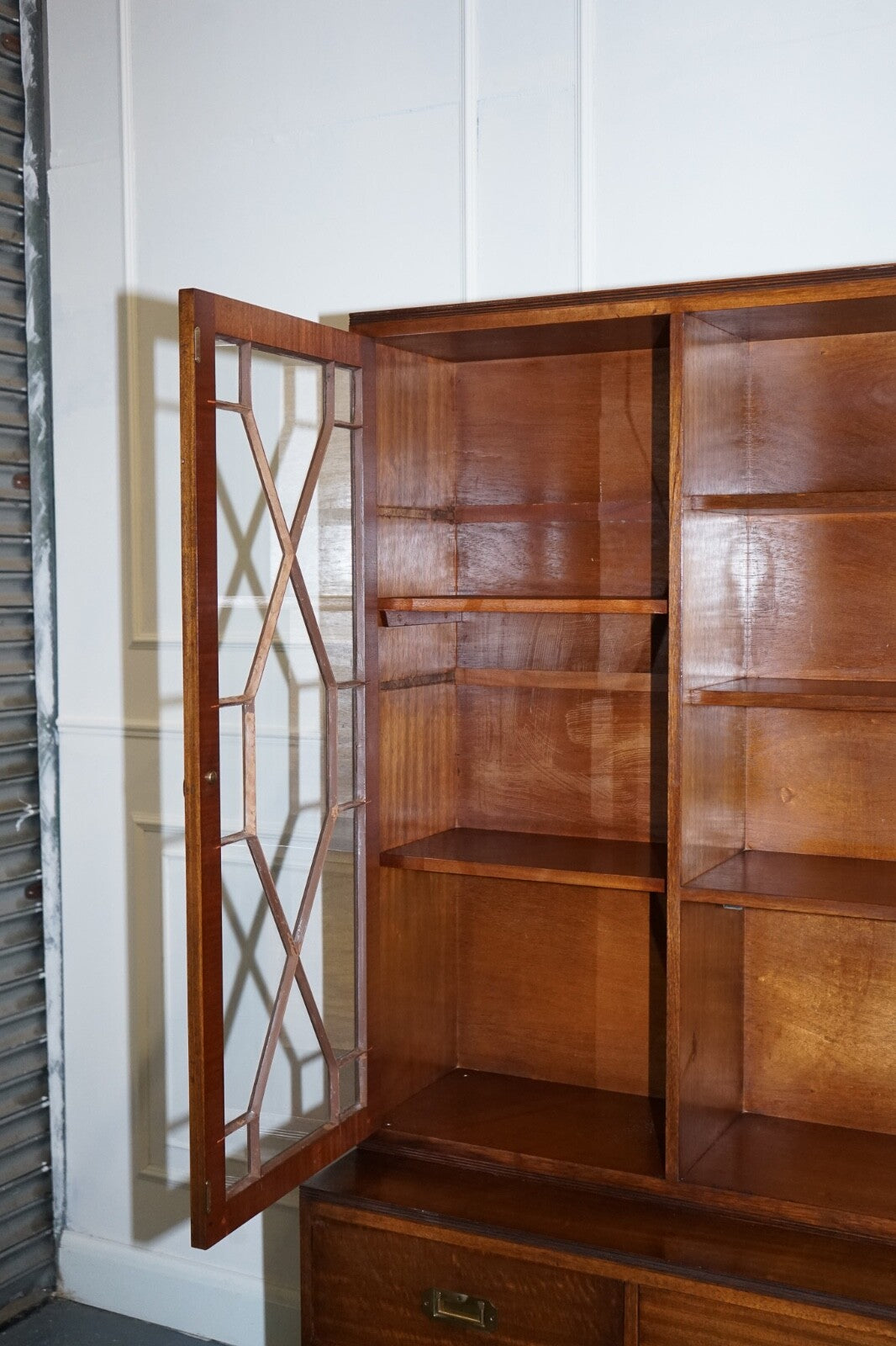 VINTAGE BEVAN FUNNELL MILITARY CAMPAIGN BOOKCASE WITH EMBOSSED LEATHER DOORS