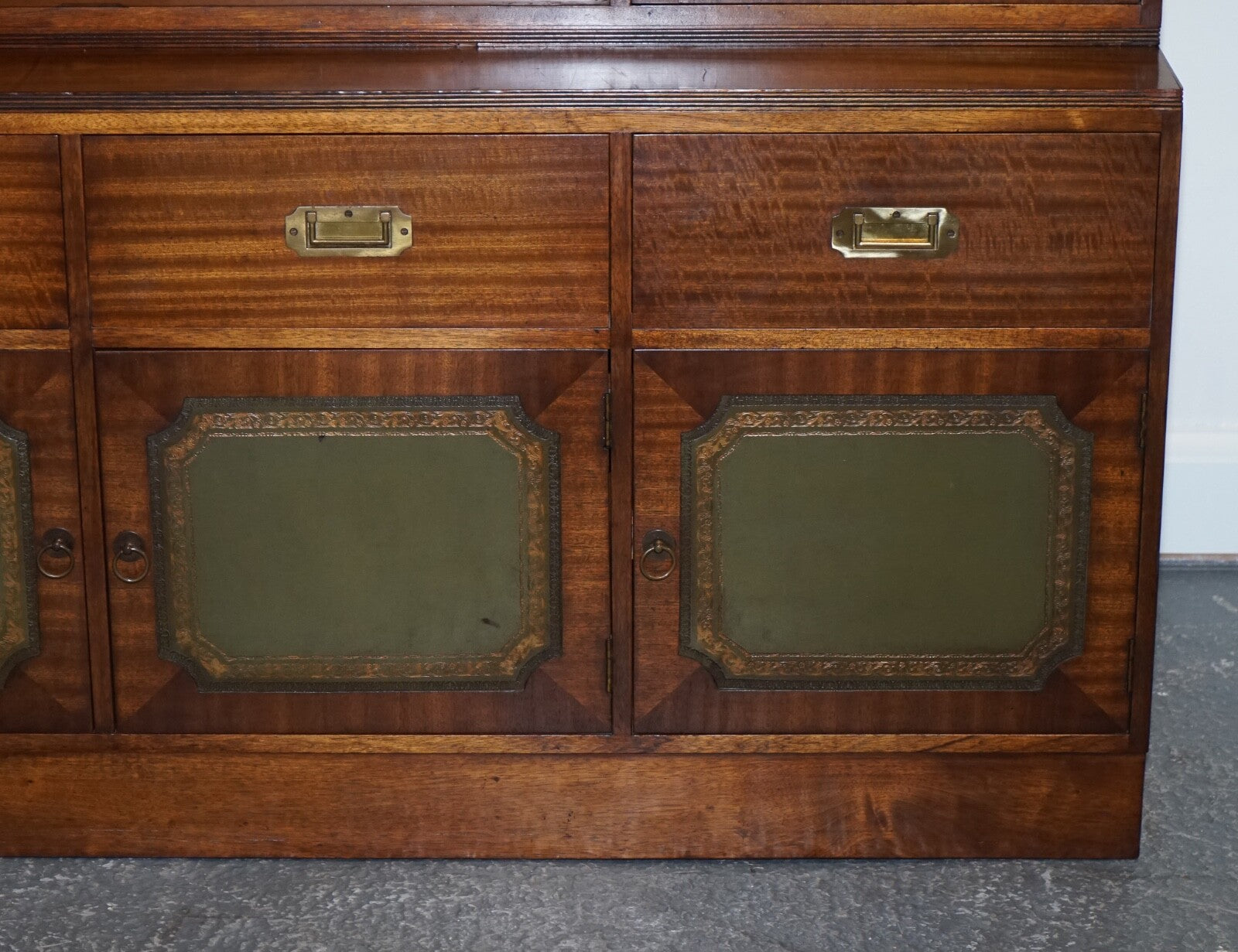 VINTAGE BEVAN FUNNELL MILITARY CAMPAIGN BOOKCASE WITH EMBOSSED LEATHER DOORS