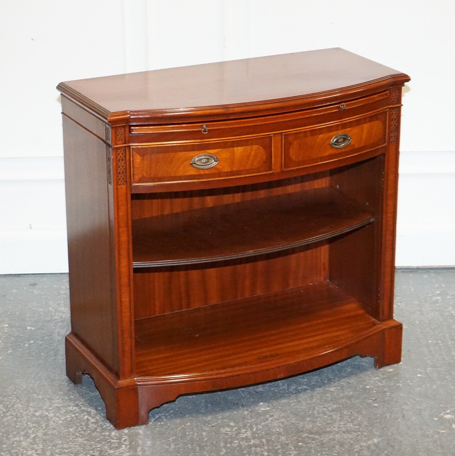 VINTAGE SERPENTINE BOW FRONT DWARF OPEN BOOKCASE WITH TWO DRAWERS BY WADE